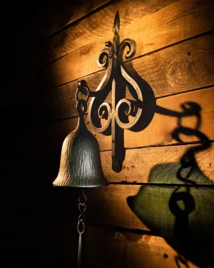 Dinner Bell, Cast Iron Design, Featured On An Antique Vintage Rustic Farmhouse Bracket